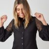 Hanna’s limited-edition batiste and silk blend shirt with hand-crocheted lace in black