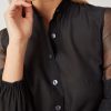 Hanna’s limited-edition batiste and silk blend shirt with hand-crocheted lace in black