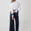 Hanna’s signature pleated-sleeve shirt with velvet ribbon detail in off-white