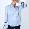 Hanna’s signature pleated-sleeve shirt with velvet ribbon detail in blue